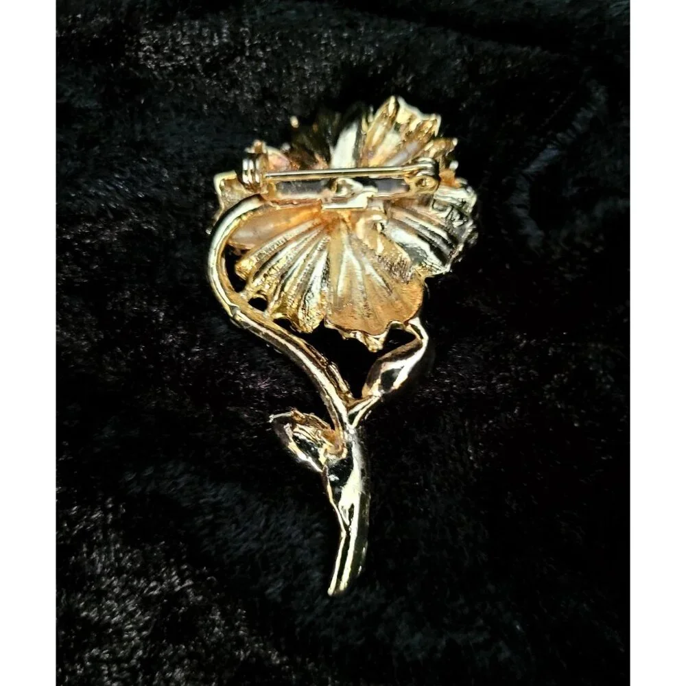 vintage gold tone floral design chrystal lined stem brooch